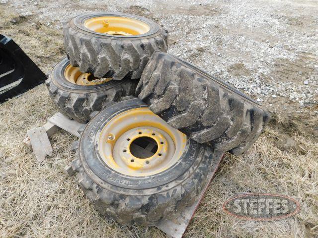 (4) 10-16.5 skid loader tires (X-MONEY)_1.jpg